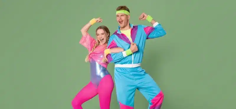 Gymondo fitness enthusiasts, Julia and Joey in 80s aerobics outfits