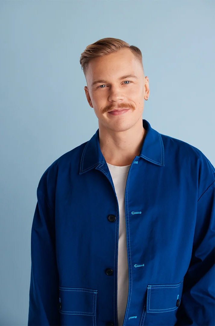 A Caucasian male model posing for a dm drogerie advertising campaign