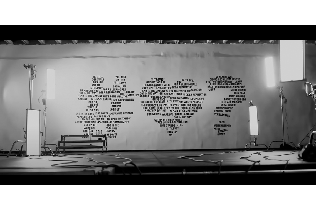 Studio 2 wall at raw studios, with lyrics from Rea Garvey's 'Is It Love?' featuring Kool Savas dynamically sprayed in black and white for the music video