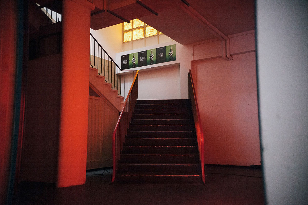 Staircase leading up to the studios at raw studios. Red light dimmed