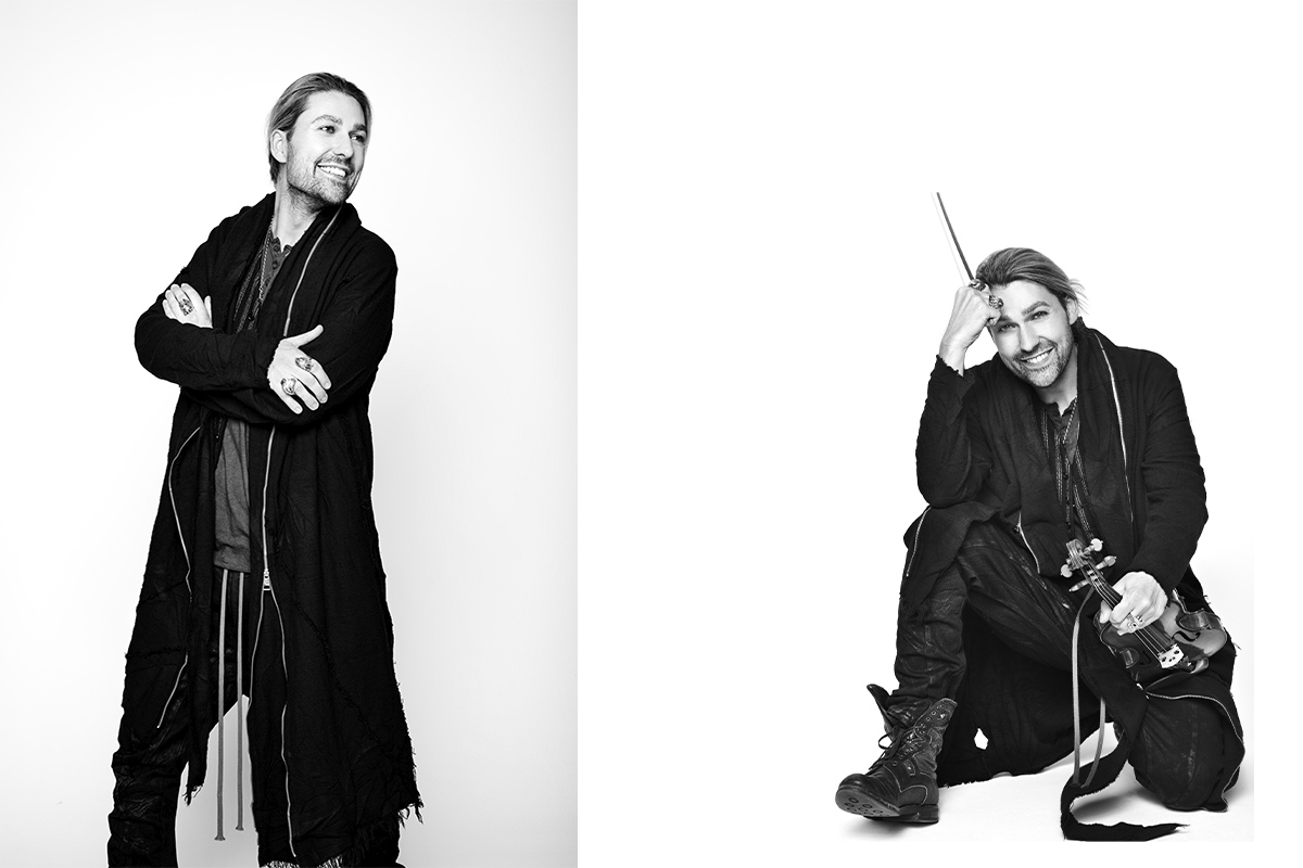 A diptych of black and white portraits featuring David Garrett. On the left, he stands confidently with arms crossed, smiling. On the right, he sits on the floor, playfully resting his head on his violin bow, exuding a charismatic and relaxed presence.