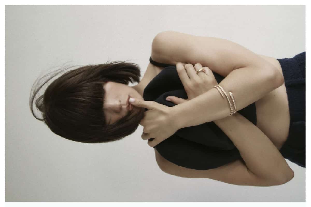 Close-up of Emilia Schüle in a minimalist studio setting, photographed for ZOO Magazine by Eric Asamoah at raw studios Berlin.